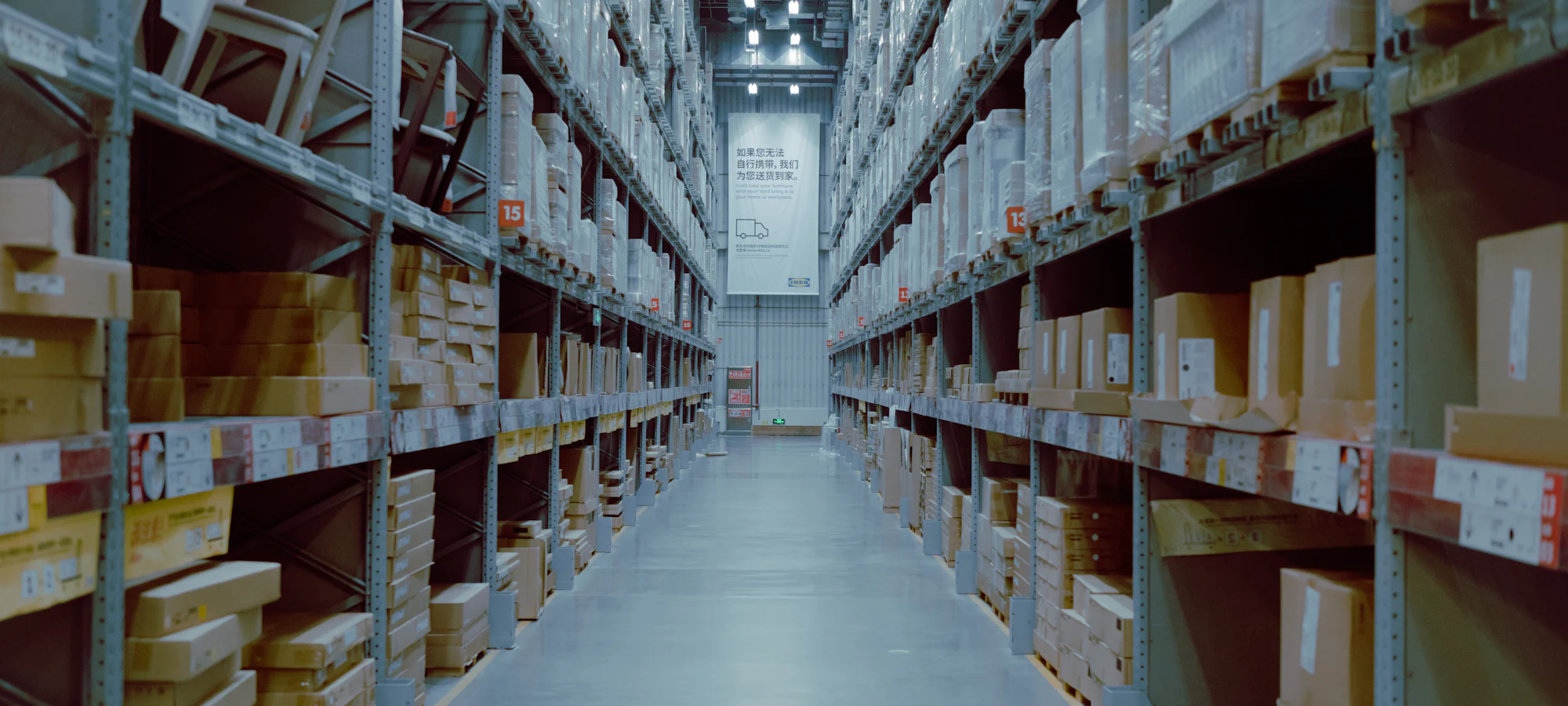 An aisle between tall warehouse racks